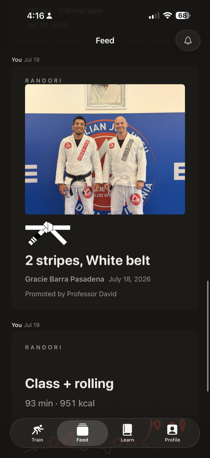 A promotion post: two stripes on a white belt at Gracie Barra Pasadena